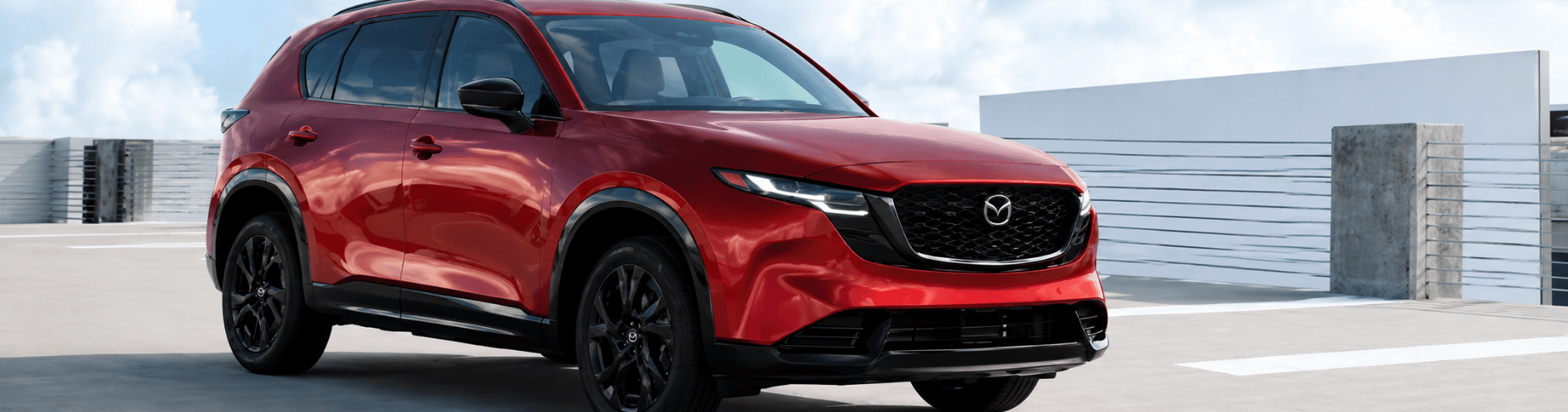Inside the Bright Bay Mazda showroom in Bay Shore, NY, where shoppers compare 2026 Mazda CX-5 lease specials